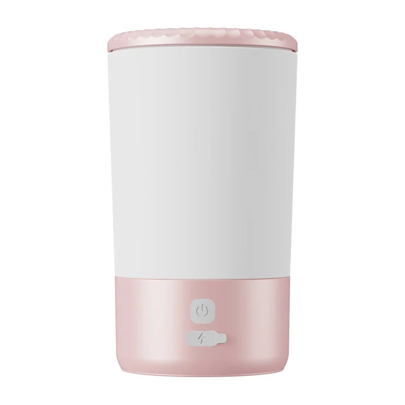 White and pink automatic pet paw cleaner cup with control icons
